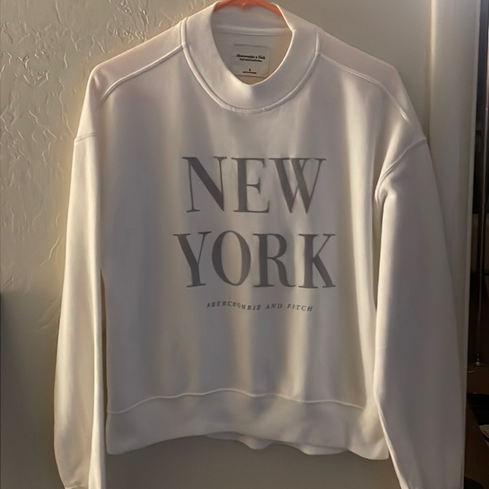 Very soft sweatshirt, size small but does not fit too snug like new